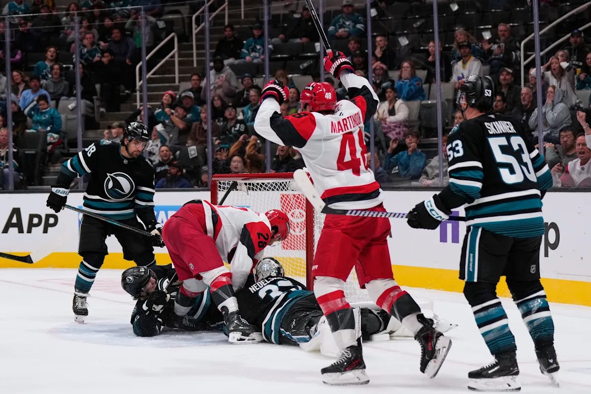 Carrier, Robinson score late in 2nd period and Hurricanes beat Sharks 5-1 to improve to 3-0